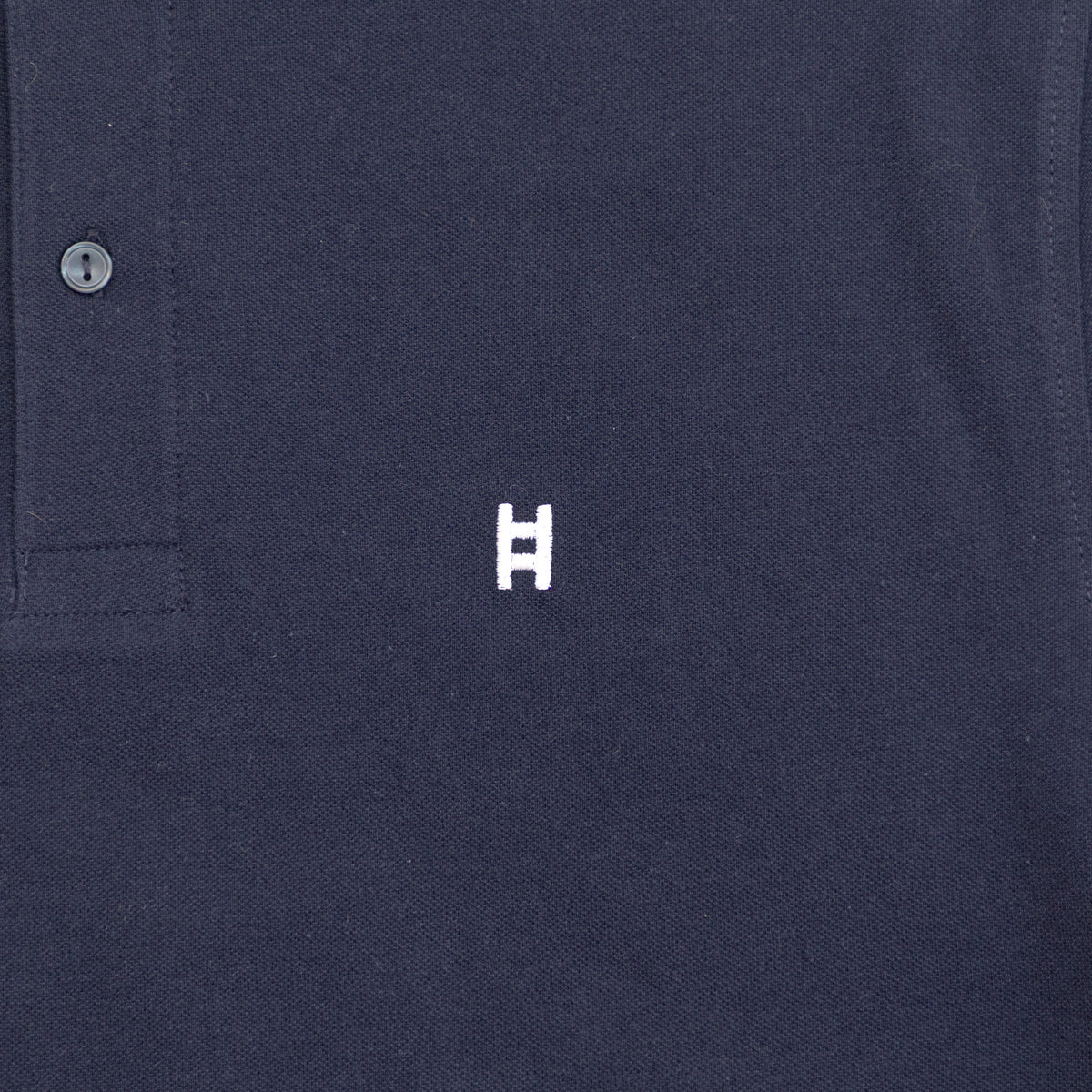 Polo manga corta H bordada